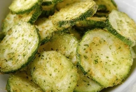 Crunchy ranch cucumber chips in a bowl, healthy snack option.