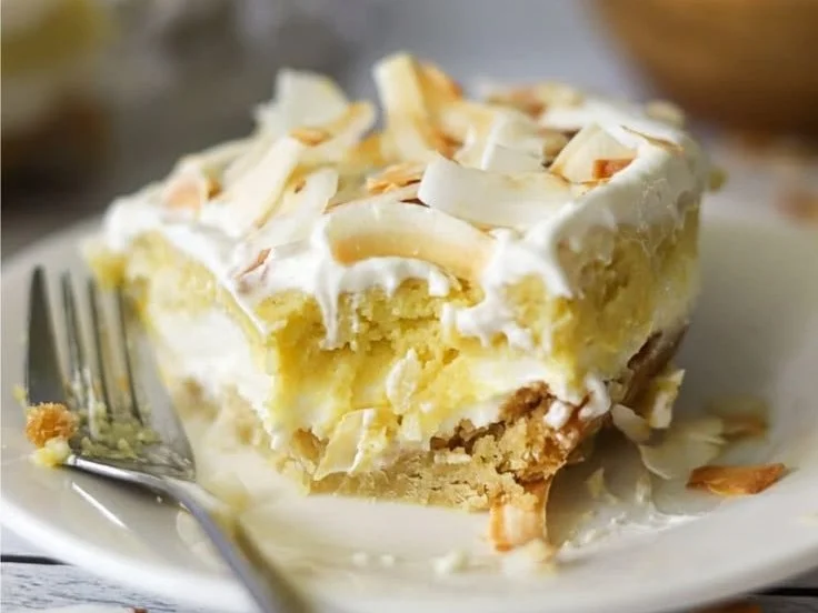 Keto Coconut Cream Dream dessert topped with fresh coconut flakes.